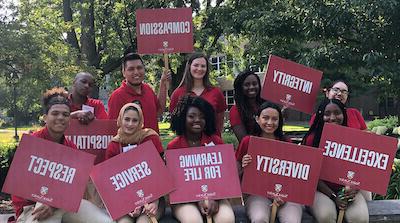 Via leaders with the core value signs in the SXU quad near the arch